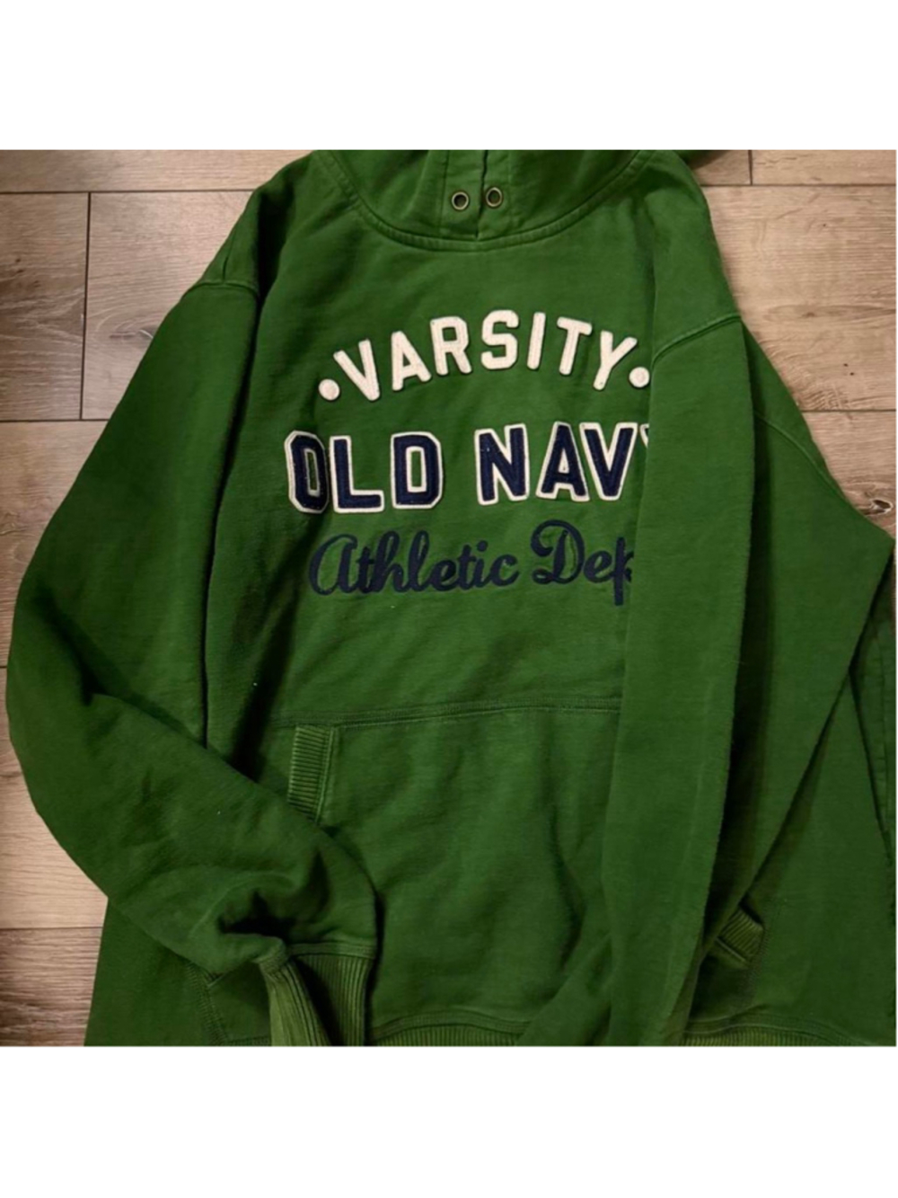Heavyweight varsity collegiate hoodie in deep forest green with oversized appliq